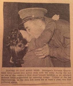 Soldier and woman kissing goodbye